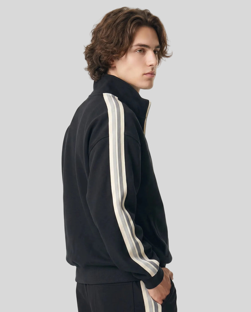 Model wearing TrackLine Club Jacket in Black side view