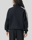 Woman Model wearing TrackLine Club Jacket in Khaki back view