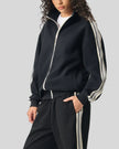 Woman Model wearing TrackLine Club Jacket in Khaki front angle view