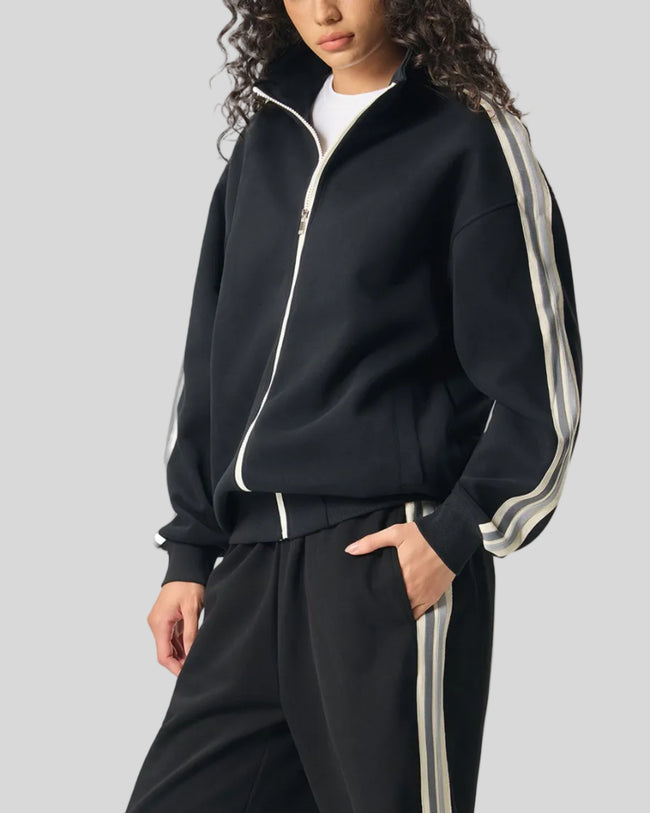 Woman Model wearing TrackLine Club Jacket in Khaki front angle view