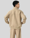 Model wearing TrackLine Club Jacket in Khaki back view
