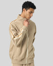 Model wearing TrackLine Club Jacket in Khaki angled front view
