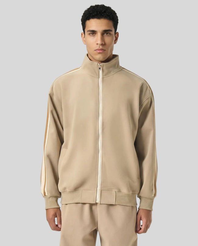 Model wearing TrackLine Club Jacket in Khaki fully zipped front view