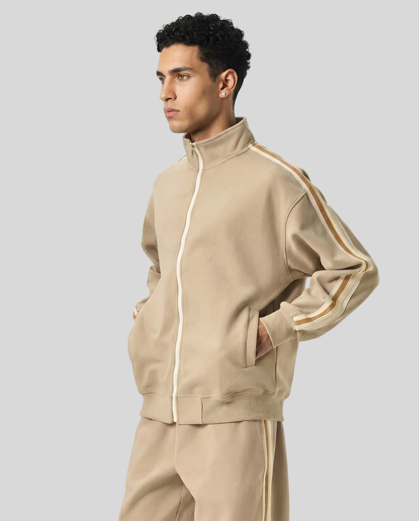 Model wearing TrackLine Club Jacket in Khaki side view