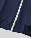 Front zipper and ribbed hem detail of TrackLine Club Jacket in Royal Blue