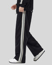 Model wearing TrackLine Club Pants in Black left side view