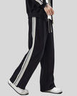 Model wearing TrackLine Club Pants in Black right side view