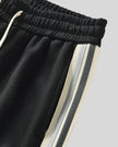Contrast side stripe detail of TrackLine Club Pants in Black