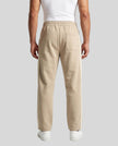 Model wearing TrackLine Club Pants in Khaki back view