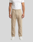 Model wearing TrackLine Club Pants in Khaki front view