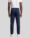 Model wearing TrackLine Club Pants in Royal Blue back view