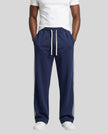 Model wearing TrackLine Club Pants in Royal Blue front view