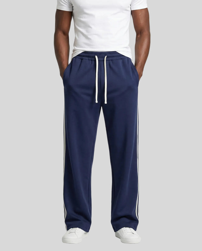 Model wearing TrackLine Club Pants in Royal Blue front view