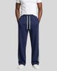 Model wearing TrackLine Club Pants in Royal Blue front view