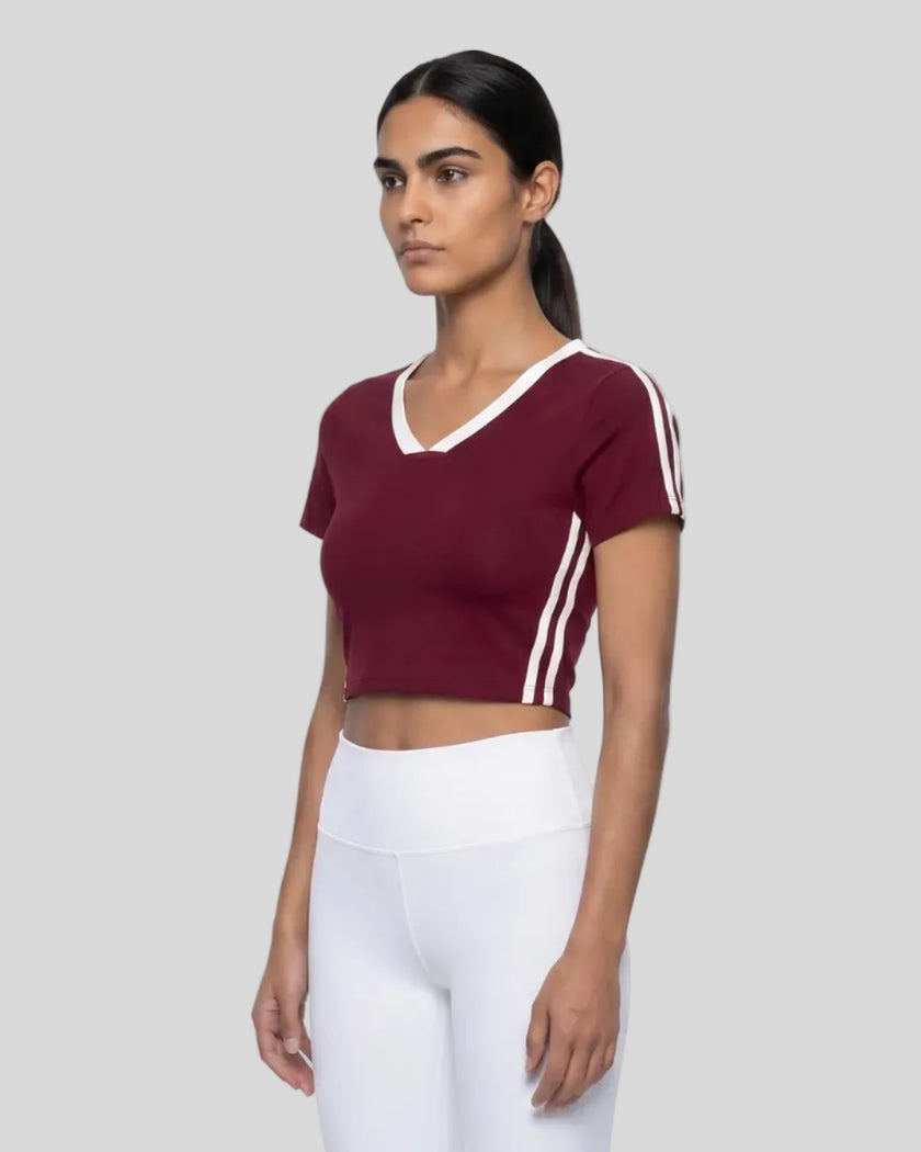 Model wearing TrackLine Club Tee in Wine Red angled front view