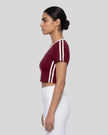 Model wearing TrackLine Club Tee in Wine Red side view
