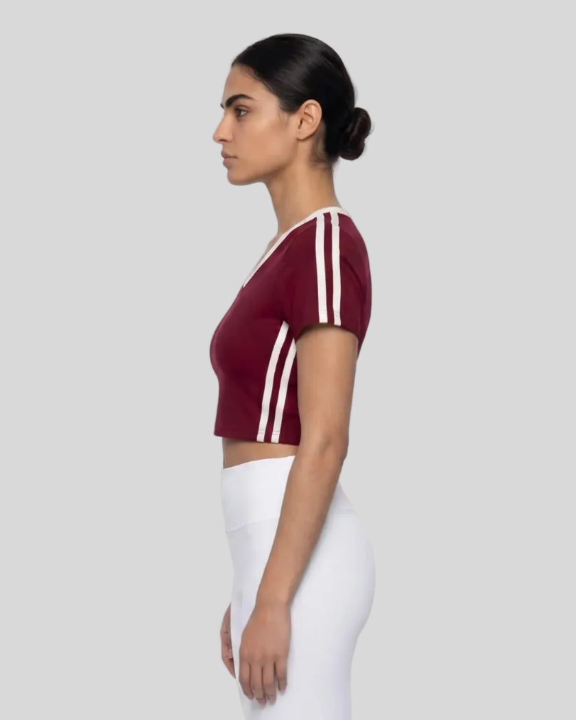 Model wearing TrackLine Club Tee in Wine Red side view