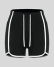 Front view of the TrackLine Color Block Performance Shorts in Black with White contrast trim