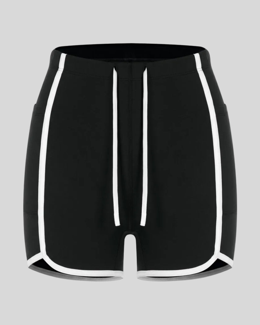 Front view of the TrackLine Color Block Performance Shorts in Black with White contrast trim