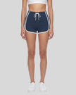 Model wearing the TrackLine Color Block Performance Shorts in Navy Blue, front view