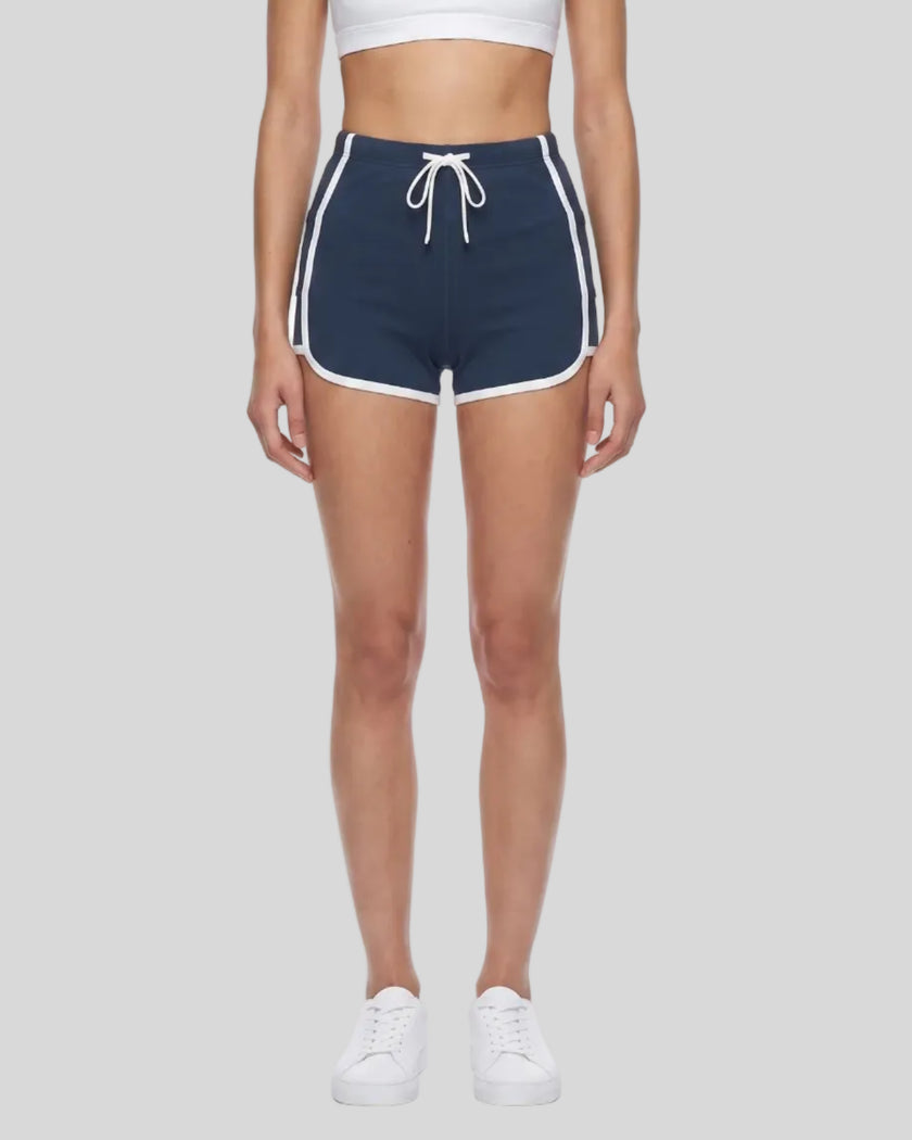 Model wearing the TrackLine Color Block Performance Shorts in Navy Blue, front view