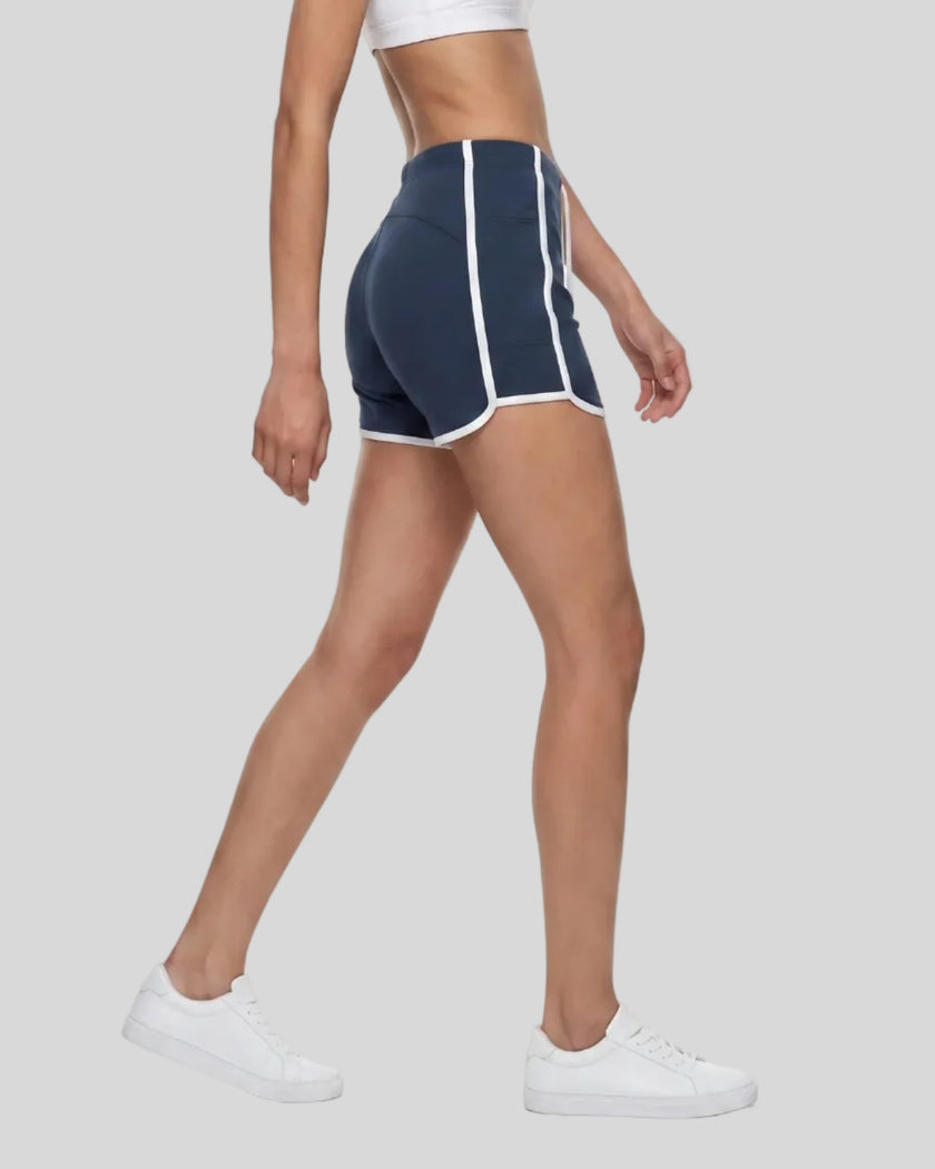 Model wearing the TrackLine Color Block Performance Shorts in Navy Blue, side angle view