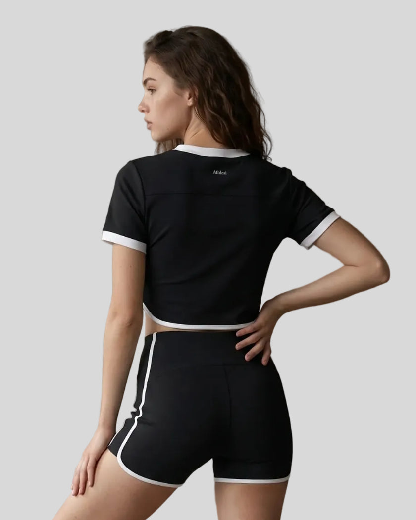 Model wearing the TrackLine Color Block Performance Tee in Black, back view