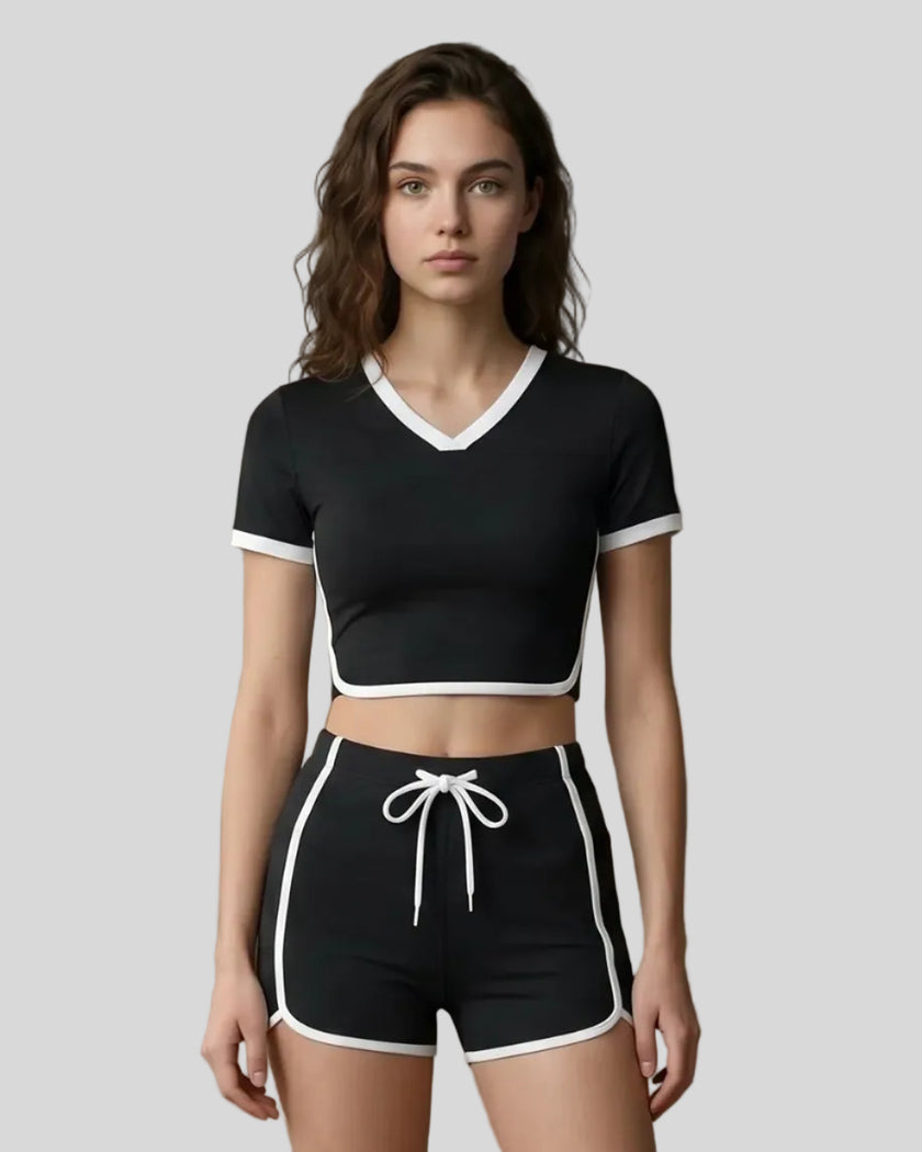 Model wearing the TrackLine Color Block Performance Tee in Black, front view