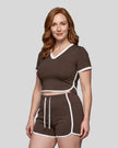 Model wearing the TrackLine Color Block Performance Tee in Coffee, front angle view