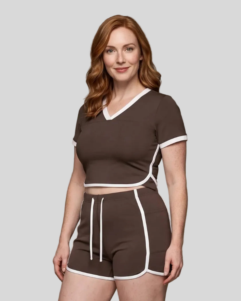 Model wearing the TrackLine Color Block Performance Tee in Coffee, front angle view