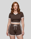 Model wearing the TrackLine Color Block Performance Tee in Coffee, front view