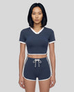 Model wearing the TrackLine Color Block Performance Tee in Navy Blue, front view