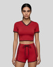 Model wearing the TrackLine Color Block Performance Tee in Red, front view