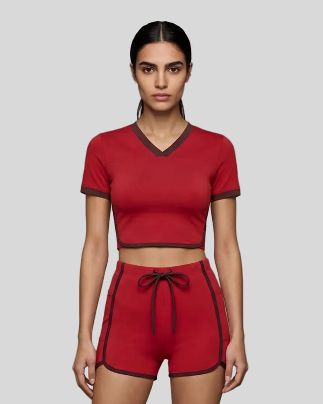 Model wearing the TrackLine Color Block Performance Tee in Red, front view