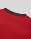 Closeup of the back neckline and stitching detail on the TrackLine Color Block Performance Tee in Red