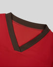 Closeup of the V-neck contrast trim on the TrackLine Color Block Performance Tee in Red