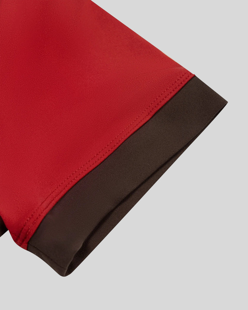 Closeup of the contrast sleeve hem on the TrackLine Color Block Performance Tee in Red
