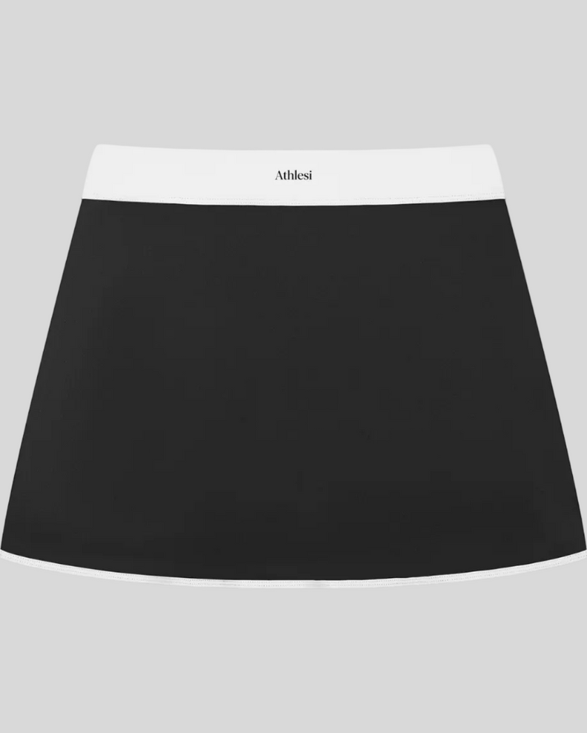 Athlesi TrackLine Color Block Skort in Black front view with white waistband and contrast trim