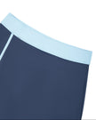 Athlesi TrackLine Color Block Skort in Navy Blue front waistband closeup with light blue color-block detail