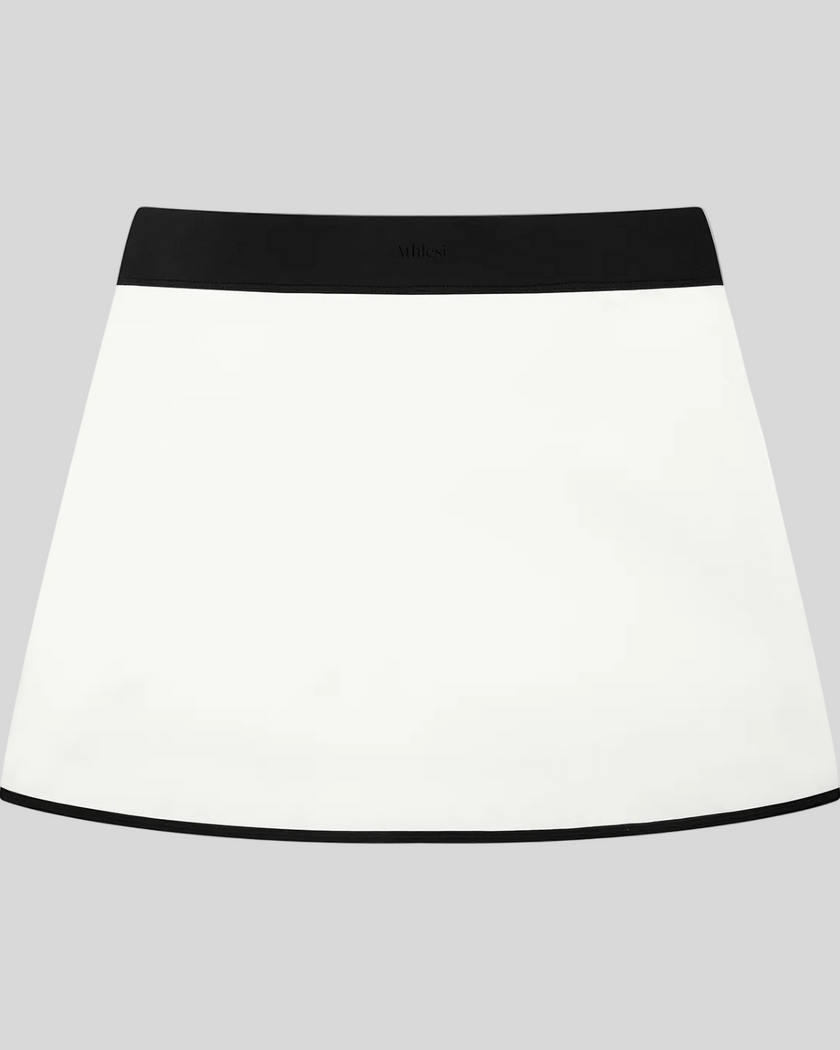 Athlesi TrackLine Color Block Skort in White back view with black waistband and contrast trim