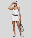 Woman wearing Athlesi TrackLine Color Block Skort in White full-body front view