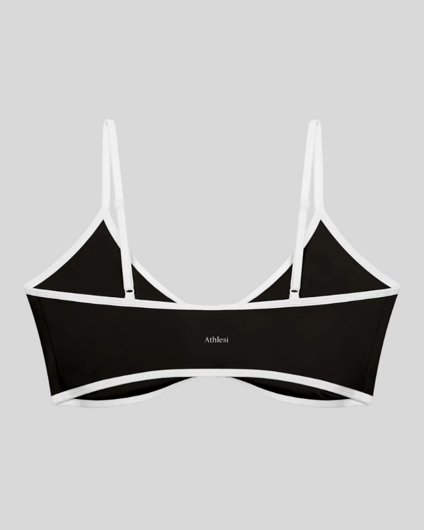 Athlesi TrackLine Color Block Sports Bra in black and white back view with contrast trim