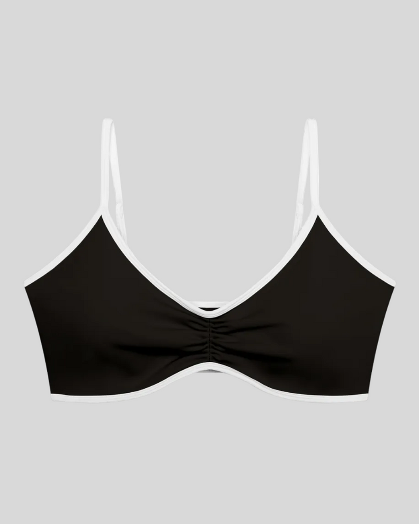 Athlesi TrackLine Color Block Sports Bra in black and white front view with ruched detail