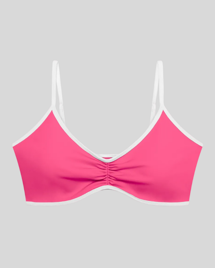 Athlesi TrackLine Color Block Sports Bra in pink and white front view with ruched detail