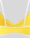 Back strap detail of the Athlesi TrackLine Color Block Sports Bra in yellow and white