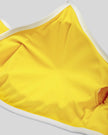 Interior fabric and support detail of the Athlesi TrackLine Color Block Sports Bra in yellow and white