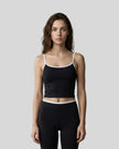 Model wearing the TrackLine Color Block Tank in black and white front view
