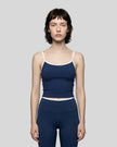Model wearing the TrackLine Color Block Tank in navy blue and white front view