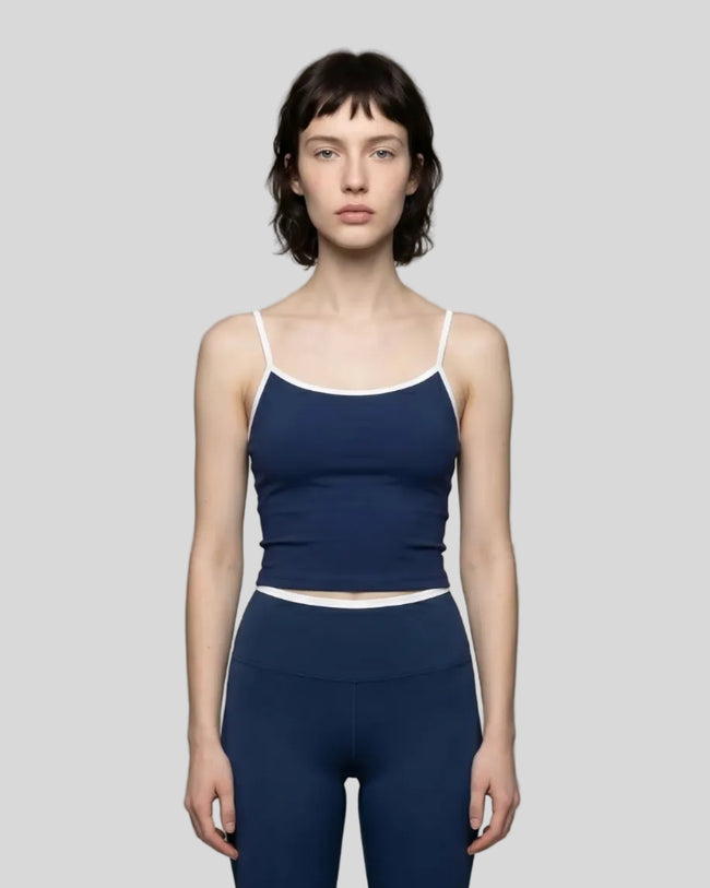 Model wearing the TrackLine Color Block Tank in navy blue and white front view