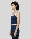 Side view of the TrackLine Color Block Tank in navy blue and white, highlighting the slim athletic fit